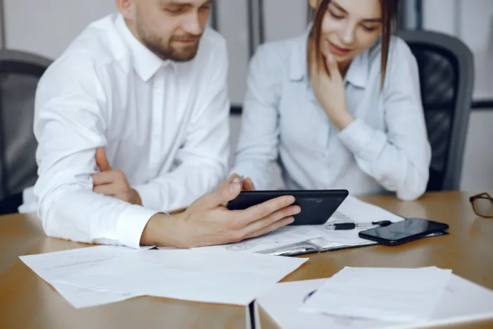Man with a tablet. Business partners at a business meeting.People sitting at the table